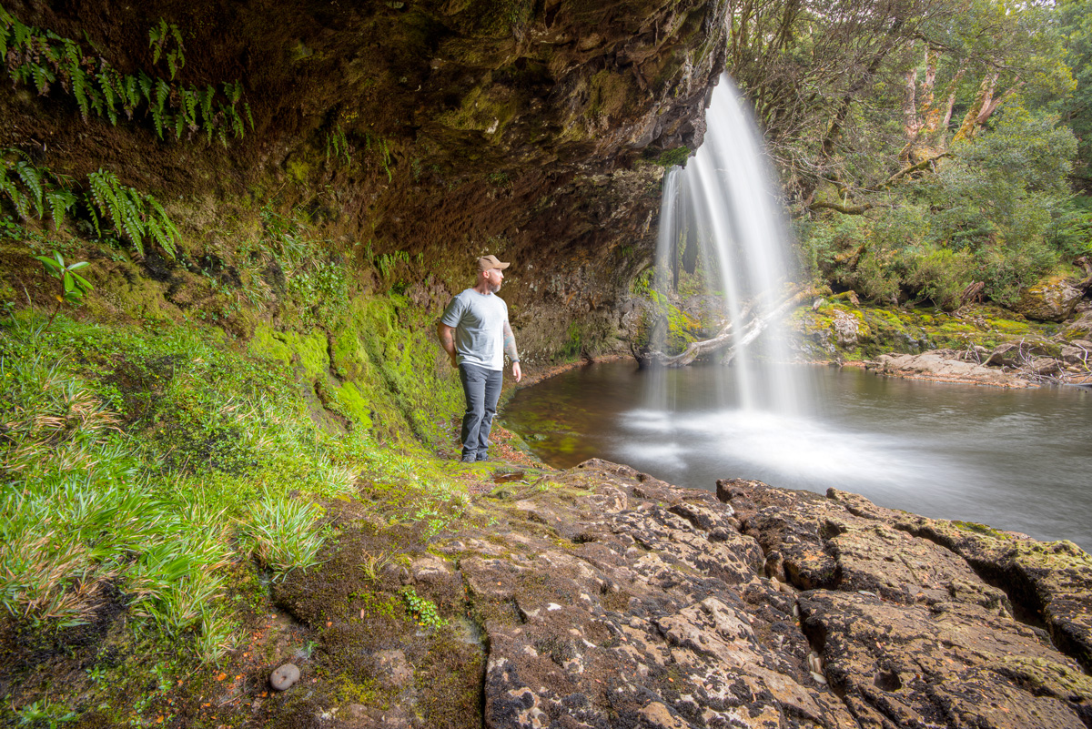 A photo of me standing below Knyvet Falls in Cradle Mountain